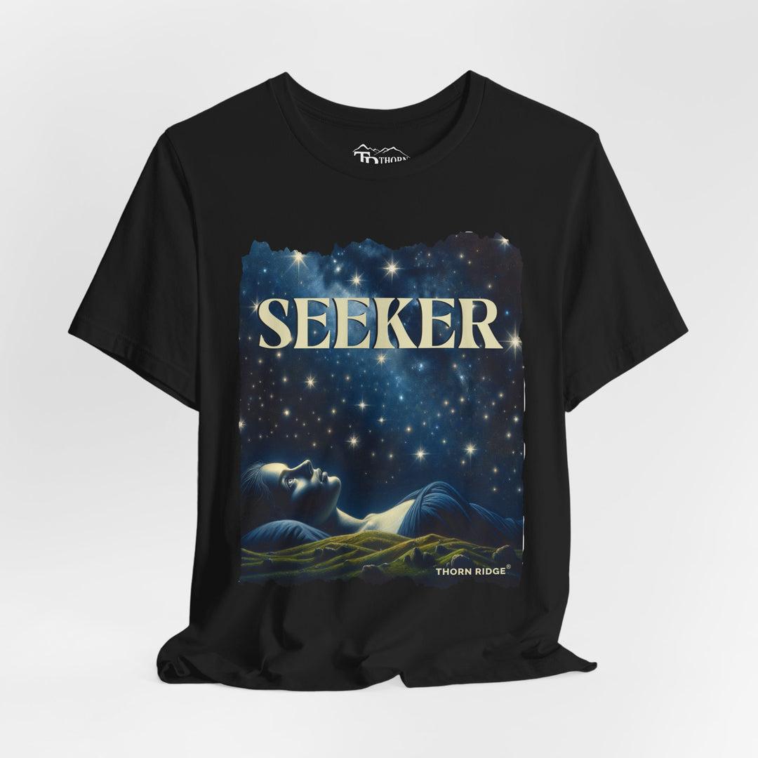 t-shirt labeled Seeker with the graphic of a woman laying on her back looking at the stars labeled Thorn Ridge®