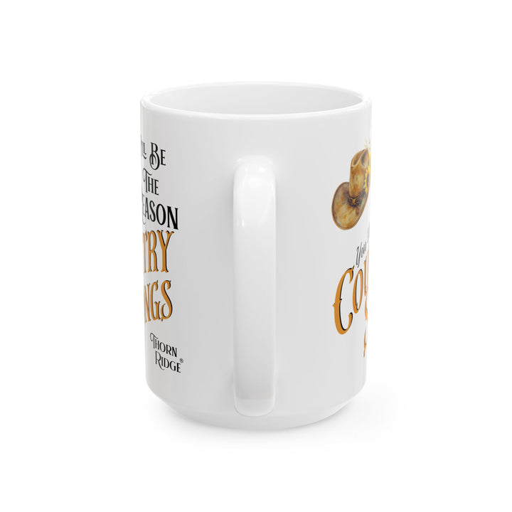 White mug with a cowboy hat and sunflower design, featuring text 'I'll Be The Reason You Write Country Songs' by Thorn Ridge.
