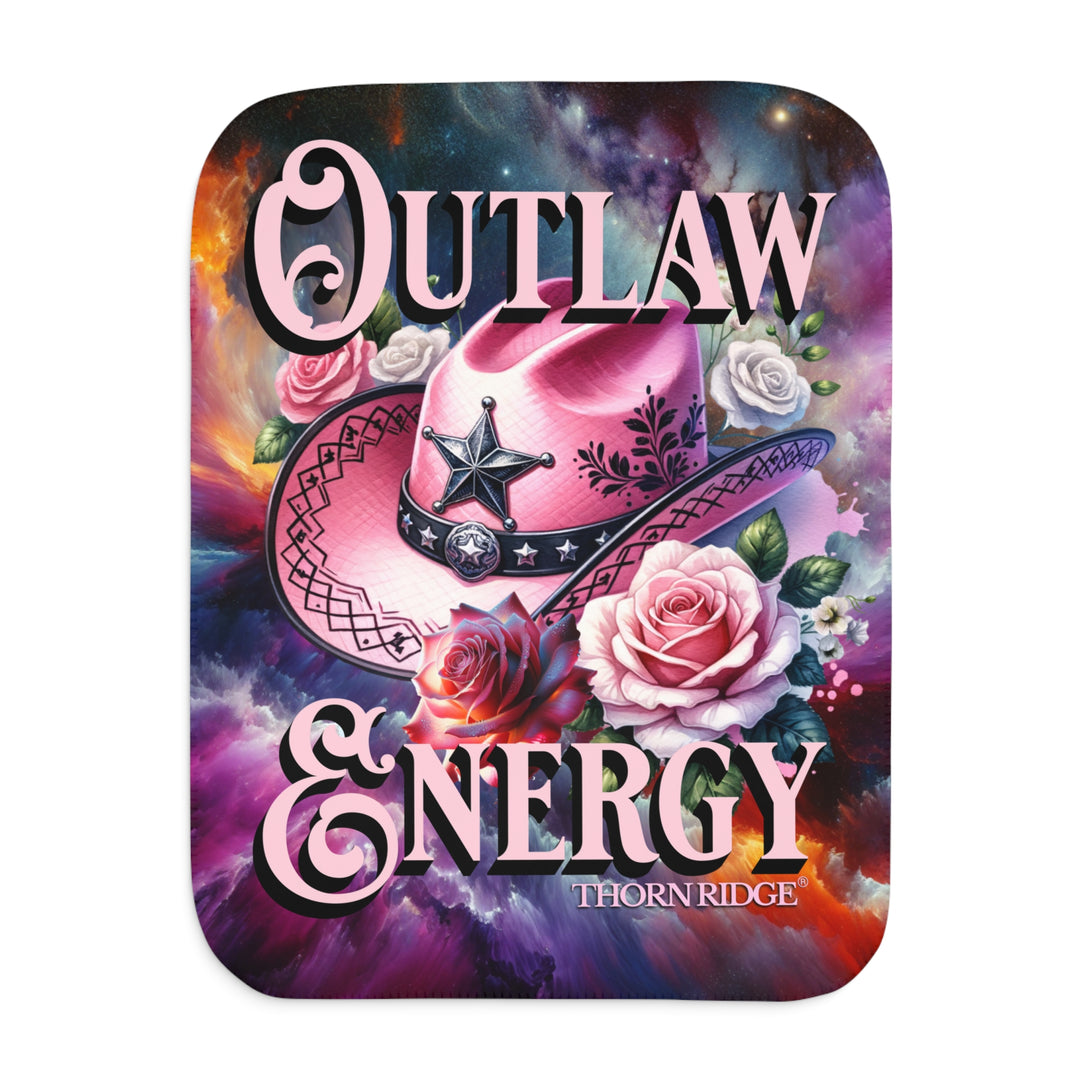 Colorful sherpa blanket with cowboy hat, roses, and 'Outlaw Energy' text on a cosmic background with Thorn Ridge branding.