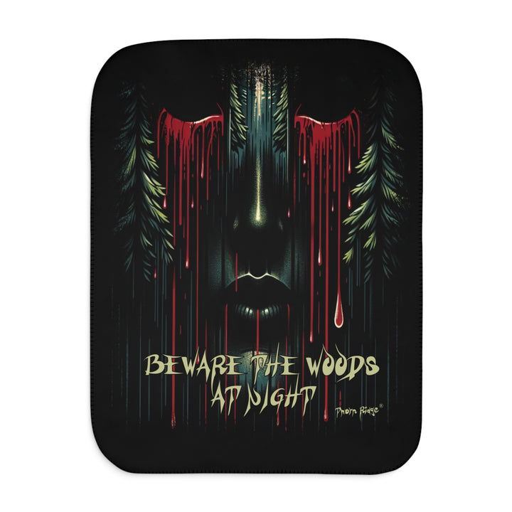Beware the Woods at Night Sherpa Blanket. A semi-hidden face with bleeding eyes flanked by pine trees.