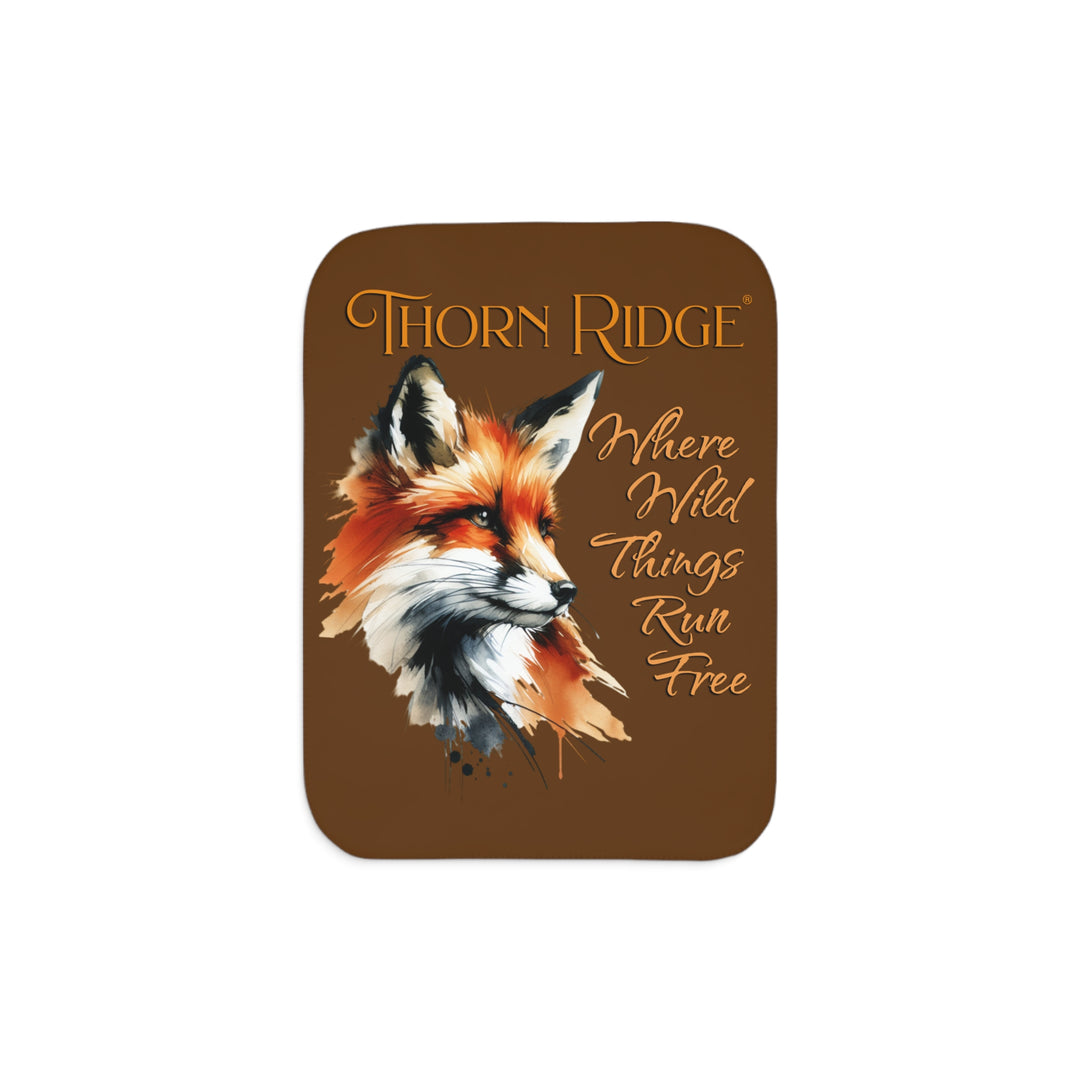Red fox sherpa blanket with the text Thorn Ridge® Where Wild Things Run Free
