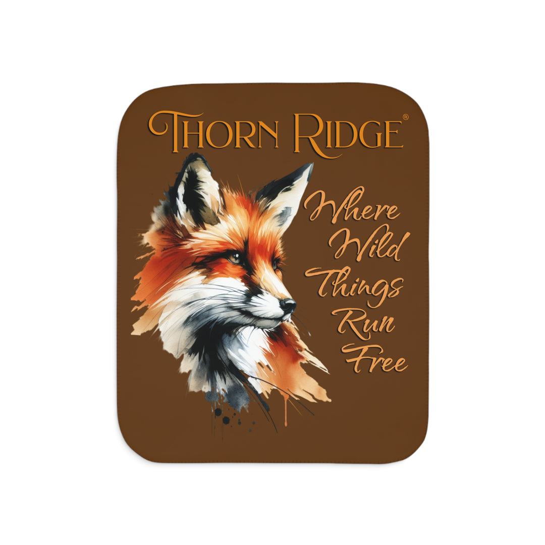 Red fox sherpa blanket with the text Thorn Ridge® Where Wild Things Run Free
