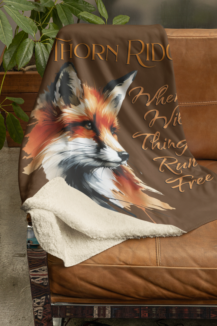Red fox sherpa blanket with the text Thorn Ridge® Where Wild Things Run Free