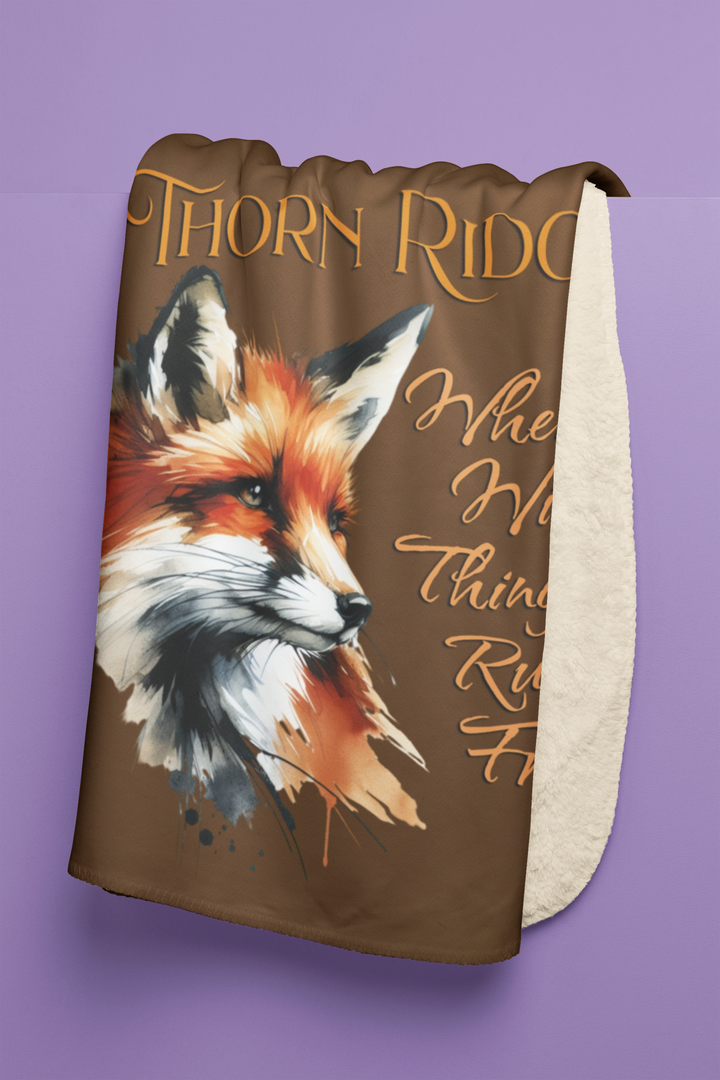 Red fox sherpa blanket with the text Thorn Ridge® Where Wild Things Run Free