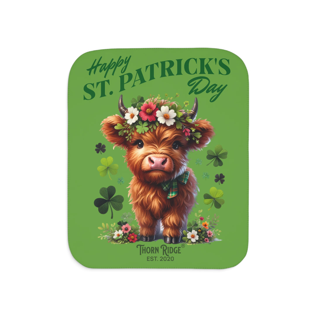 St. Patrick's Day Sherpa Blanket with a Highland cow and floral decorations on a green background branded Thorn Ridge est. 2020.