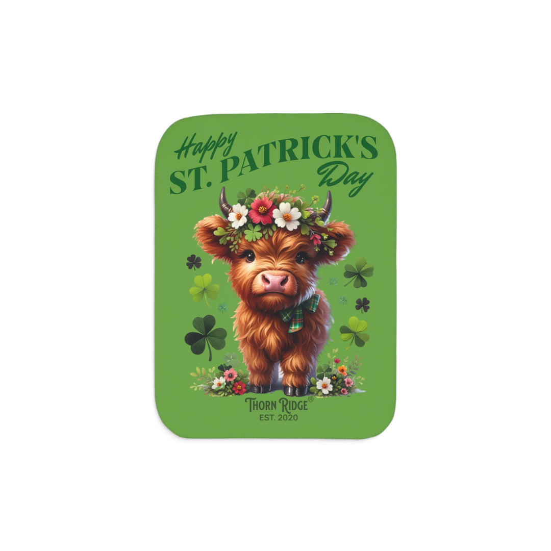 St. Patrick's Day Sherpa Blanket with a Highland cow and floral decorations on a green background branded Thorn Ridge est. 2020.
