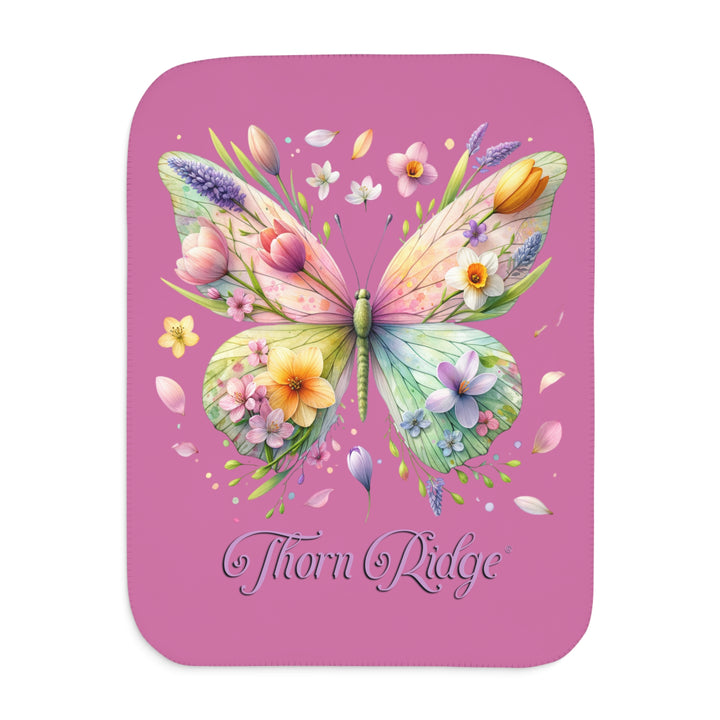 Butterfly design with flowers on a pink Sherpa blanket branded Thorn Ridge