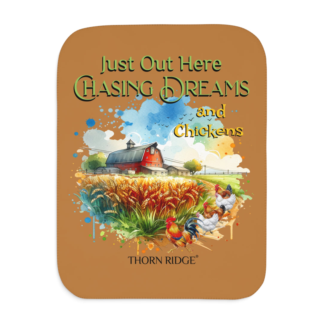 Just out here chasing dreams and chickens by Thorn Ridge® sherpa blanket. Image of a barn, wheat field and chickens running down a dirt road.