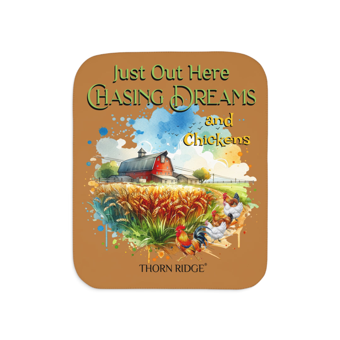 Just out here chasing dreams and chickens by Thorn Ridge® sherpa blanket. Image of a barn, wheat field and chickens running down a dirt road.