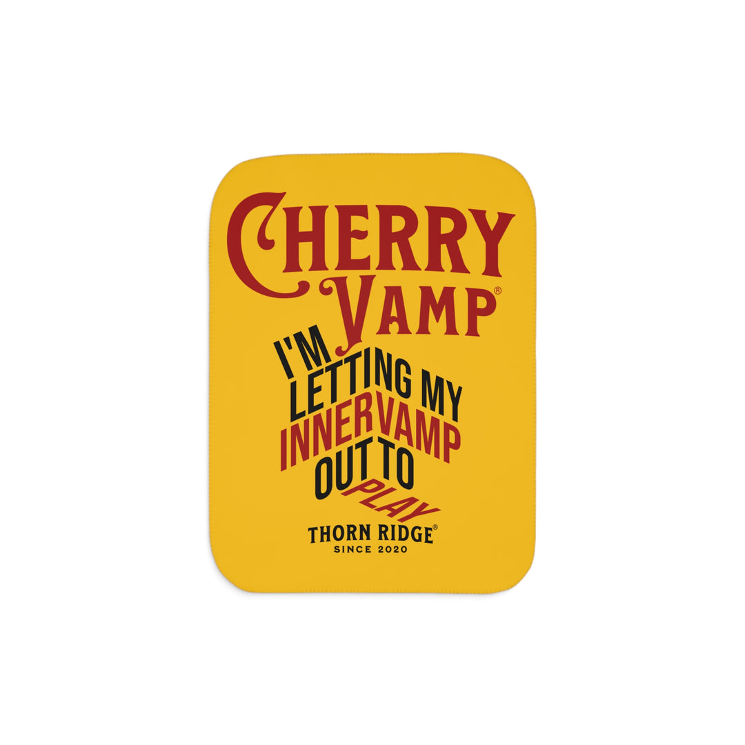 Cherry Vamp® by Thorn Ridge® Sherpa Blanket in yellow with red and black text