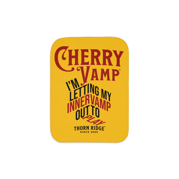 Cherry Vamp® by Thorn Ridge® Sherpa Blanket in yellow with red and black text