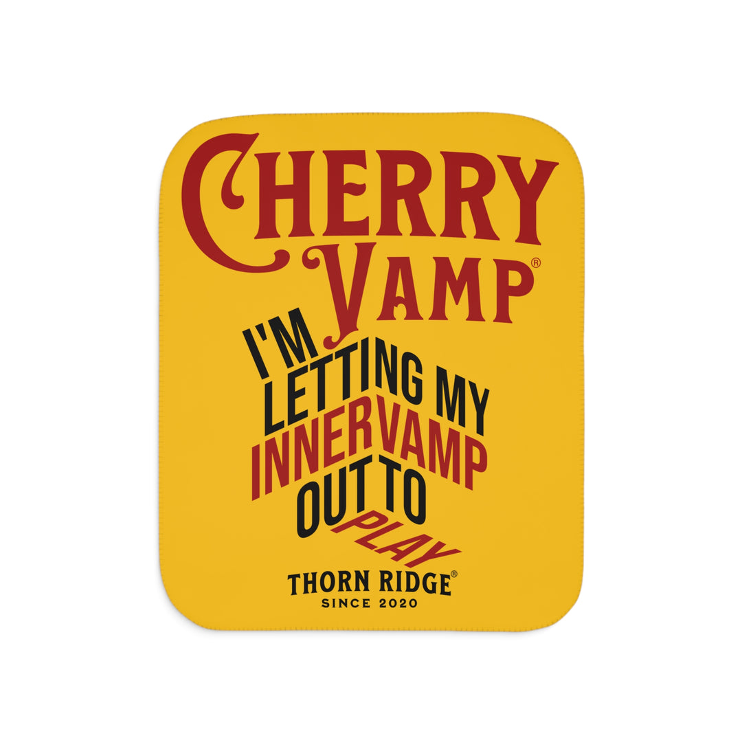 Cherry Vamp® by Thorn Ridge® Sherpa Blanket in yellow with red and black text