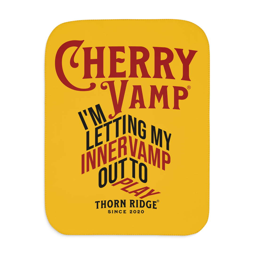 Cherry Vamp® by Thorn Ridge® Sherpa Blanket in yellow with red and black text