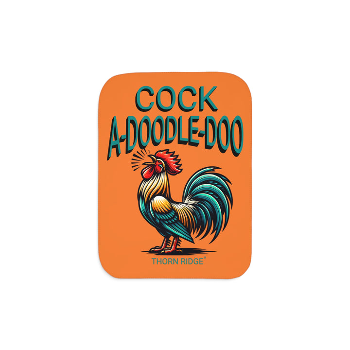 Orange sherpa blanket with a rooster illustration and 'Cock A Doodle Doo' text with branding Thorn Ridge®