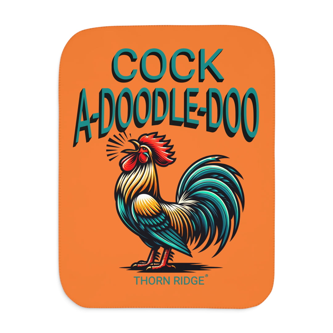 Orange sherpa blanket with a rooster illustration and 'Cock A Doodle Doo' text with branding Thorn Ridge®