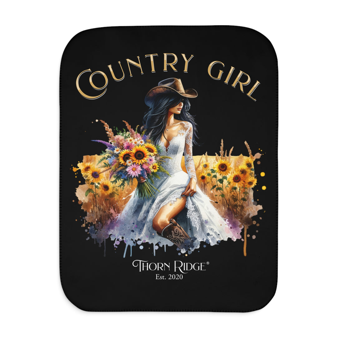 Decorative black sherpa blanket with a Country Girl design featuring a woman, flowers, and the Thorn Ridge logo.