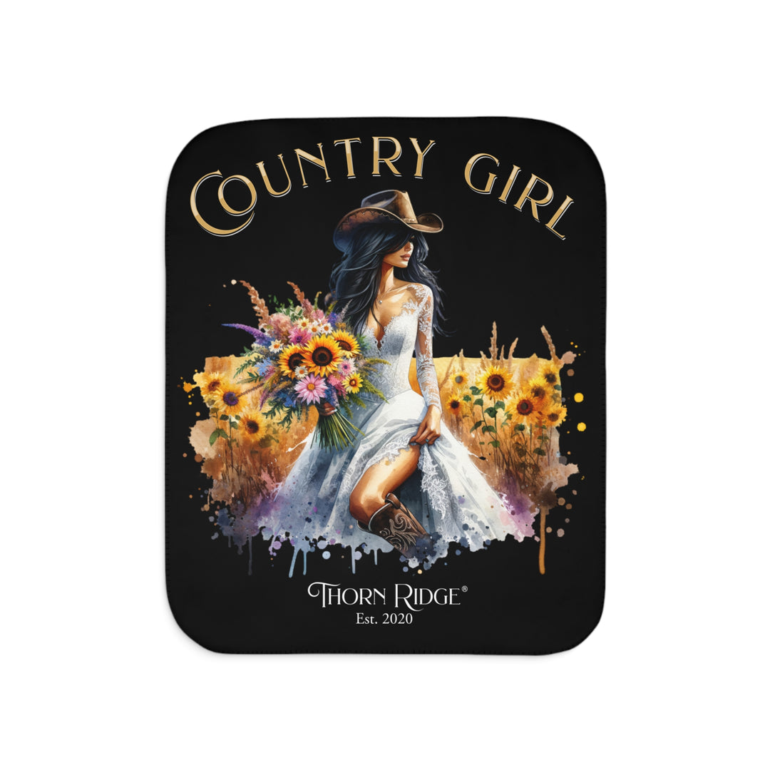 Decorative black sherpa blanket with a Country Girl design featuring a woman, flowers, and the Thorn Ridge logo.