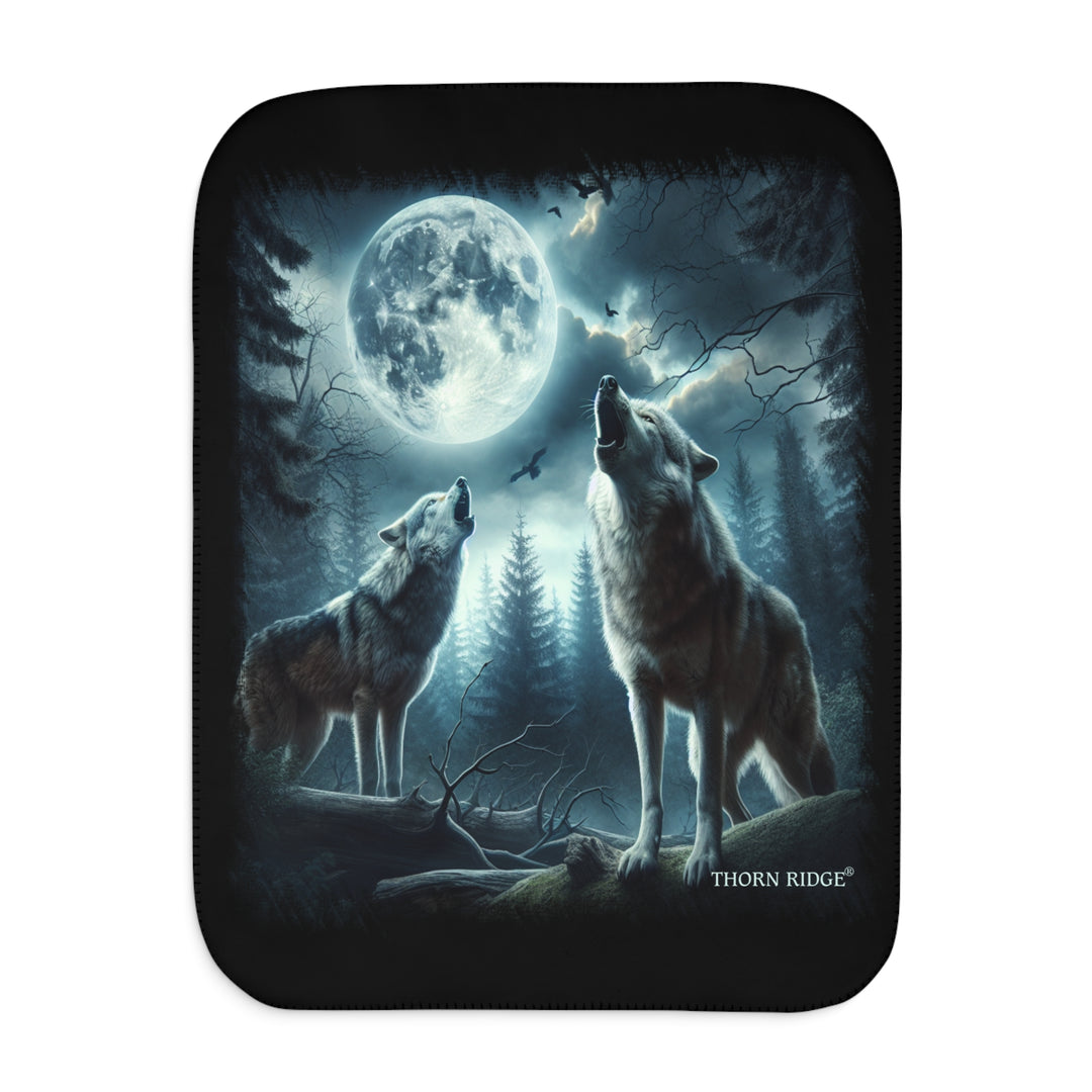 Moonlit Wolves sherpa blanket by Thorn Ridge® featuring two gray wolves deep in the forest howling at the moon with black birds flying around in the sky.