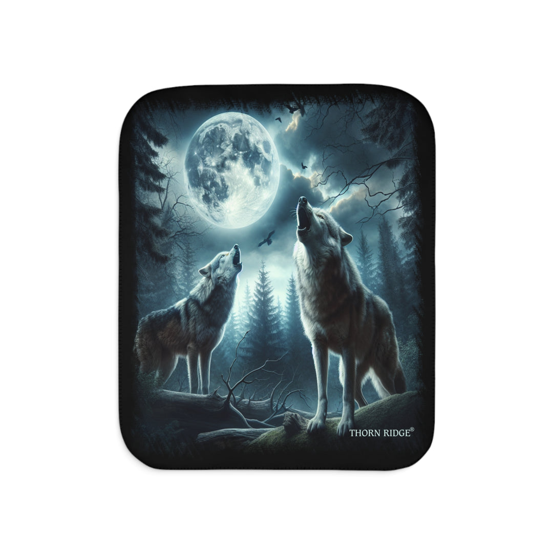 Moonlit Wolves sherpa blanket by Thorn Ridge® featuring two gray wolves deep in the forest howling at the moon with black birds flying around in the sky.