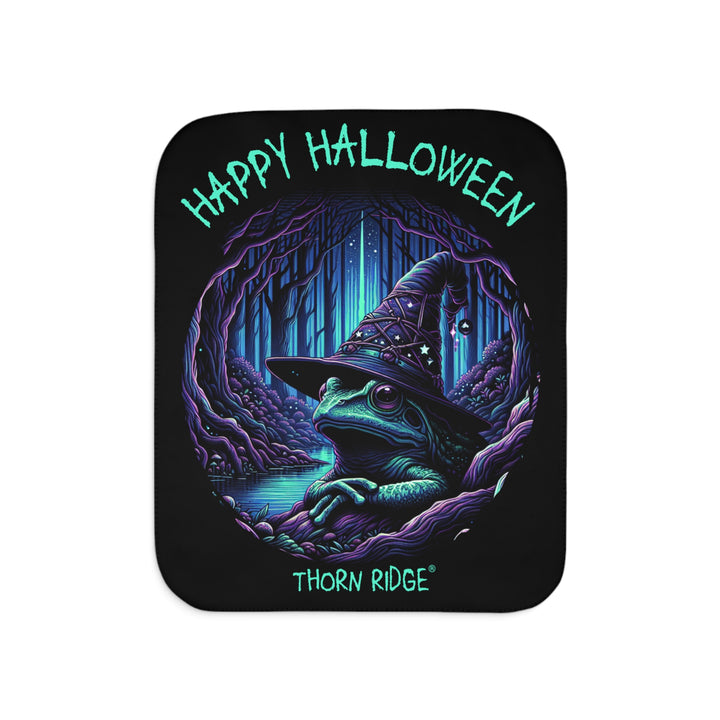 Happy Halloween black sherpa blanket with an image of the Frog Witch wearing a witch hat sitting by the creek by Thorn Ridge®