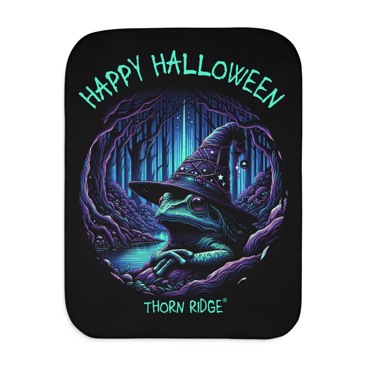 Happy Halloween black sherpa blanket with an image of the Frog Witch wearing a witch hat sitting by the creek by Thorn Ridge®