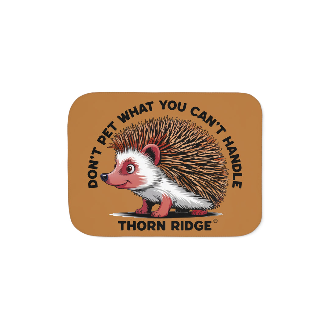 Light brown sherpa blanket with hedgehog illustration and text 'Don't pet what you can't handle' by Thorn Ridge®.