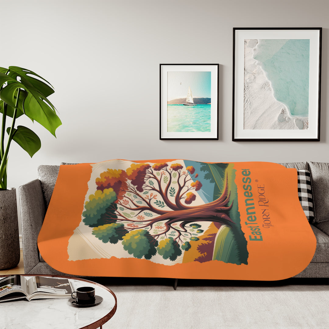 Orange sherpa blanket with an autumn tree design and East Tennessee and branded Thorn Ridge®