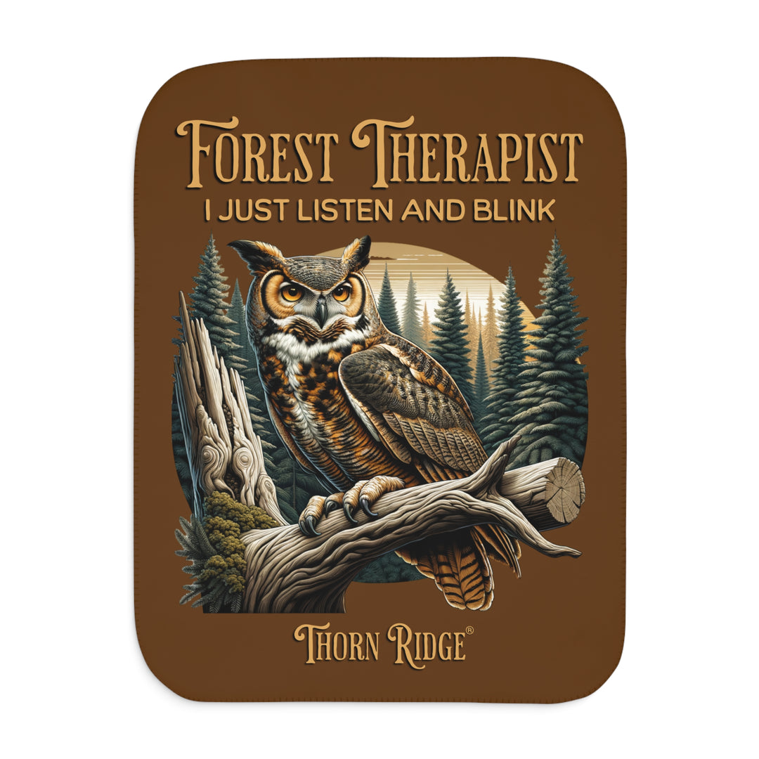 Brown Forest Therapist Sherpa blanket featuring an owl perched on a tree branch with trees in the background branded Thorn Ridge®