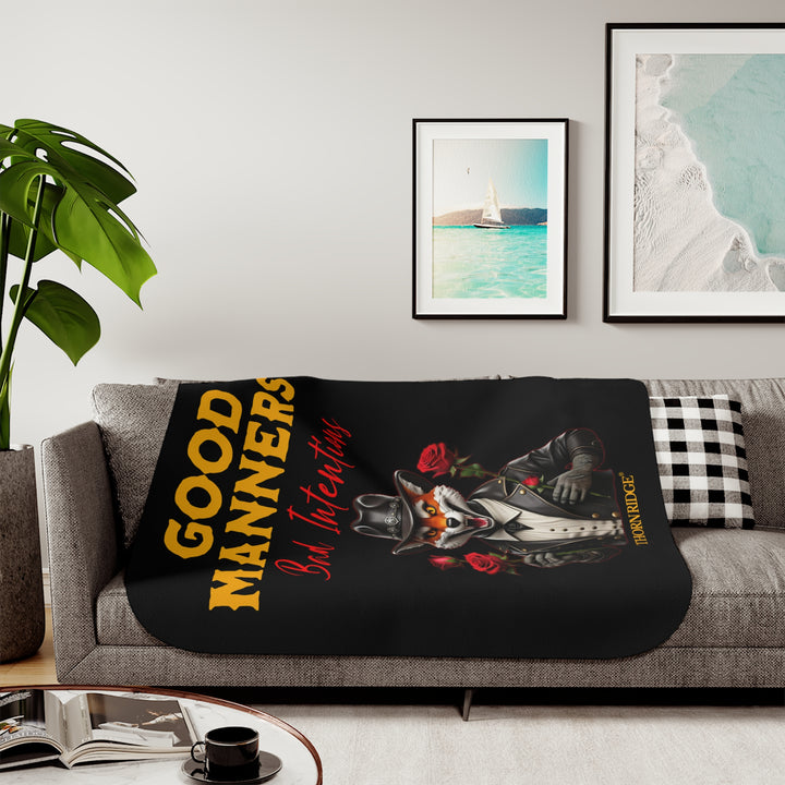 fox character in a black leather jacket and black leather cowboy hat, holding roses, and text 'Good Manners Bad Intentions' on a black sherpa blanket by Thorn Ridge®