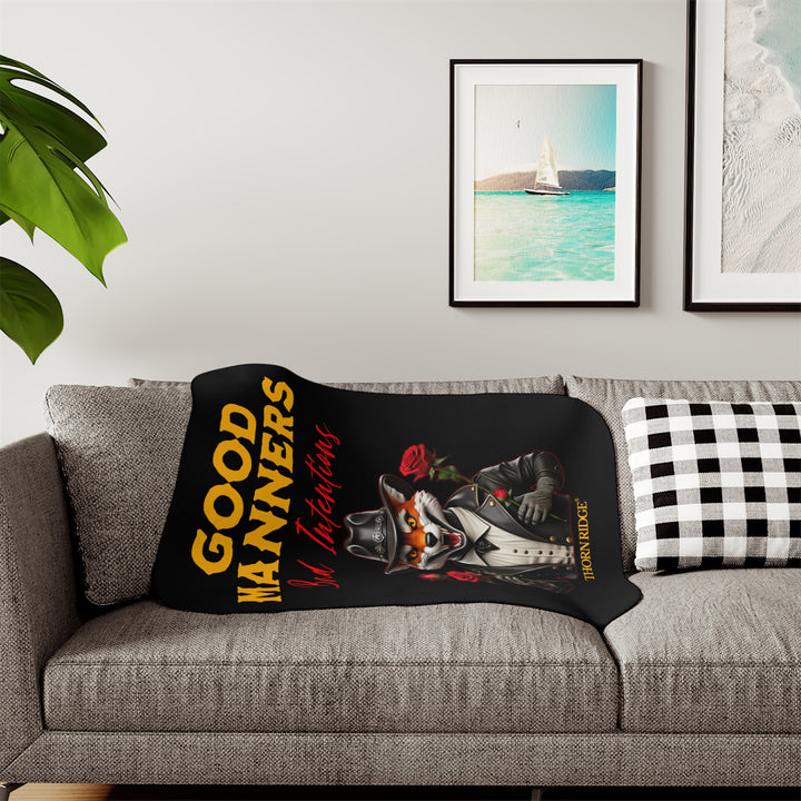 fox character in a black leather jacket and black leather cowboy hat, holding roses, and text 'Good Manners Bad Intentions' on a black sherpa blanket by Thorn Ridge®