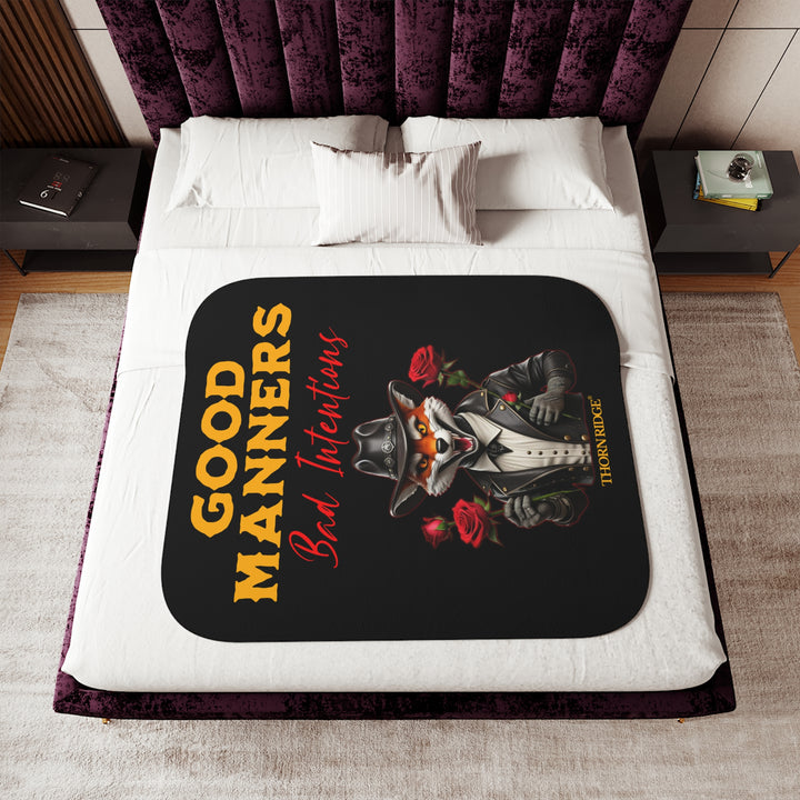 fox character in a black leather jacket and black leather cowboy hat, holding roses, and text 'Good Manners Bad Intentions' on a black sherpa blanket by Thorn Ridge®
