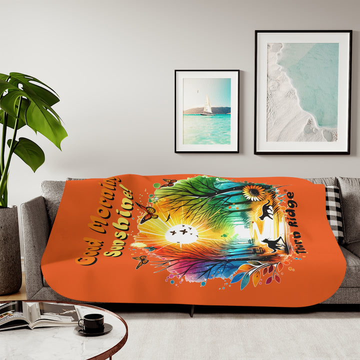 Colorful design of two cats in a park at sunrise with 'Good Morning Sunshine!' text on an orange sherpa blanket and branded Thorn Ridge®