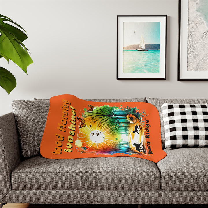 Colorful design of two cats in a park at sunrise with 'Good Morning Sunshine!' text on an orange sherpa blanket and branded Thorn Ridge®