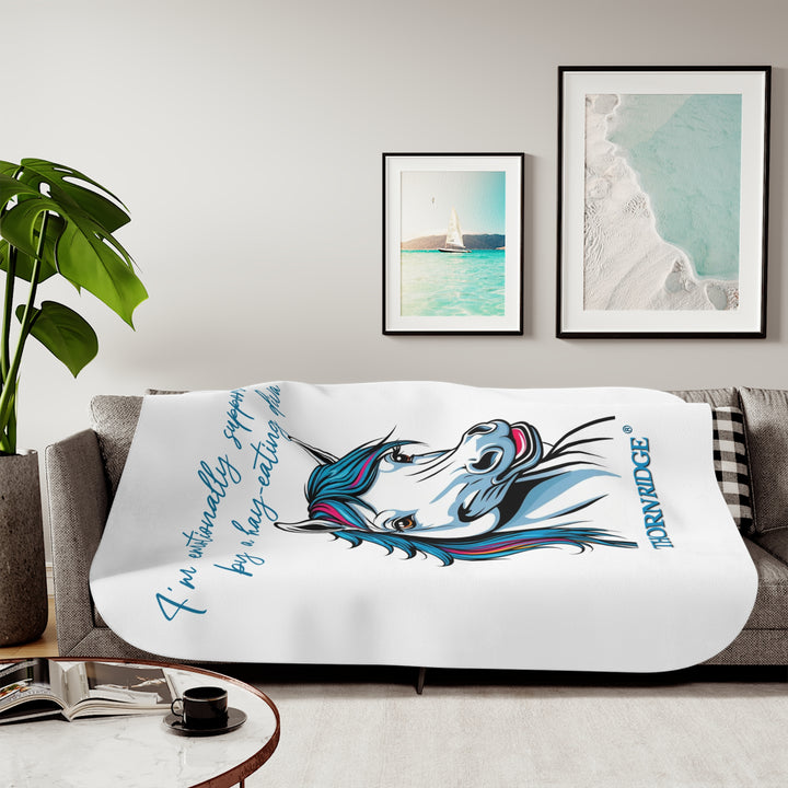 Hay Eating Diva slogan by Thorn Ridge with a cartoon white horse with blue orange red and fushia hair on a white sherpa blanket with blue text.