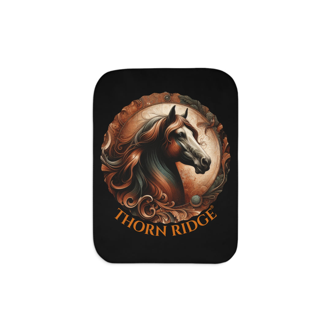 Decorative and elegant horse design in brown and green tones with 'Thorn Ridge®' branding on a black sherpa blanket.