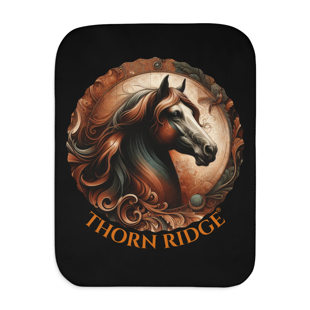 Decorative and elegant horse design in brown and green tones with 'Thorn Ridge®' branding on a black sherpa blanket.