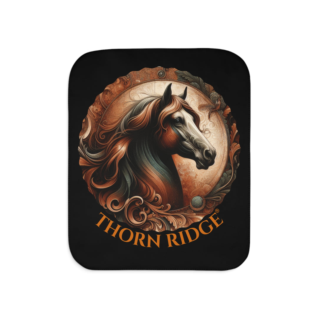 Decorative and elegant horse design in brown and green tones with 'Thorn Ridge®' branding on a black sherpa blanket.
