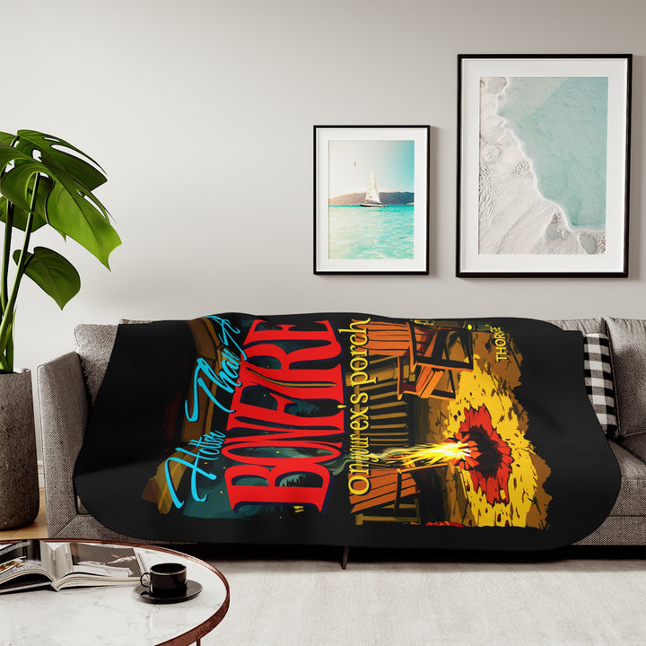 Hotter than a bonfire on your ex's porch slogan by Thorn Ridge® on a black sherpa blanket with the image of a bonfire on a porch.