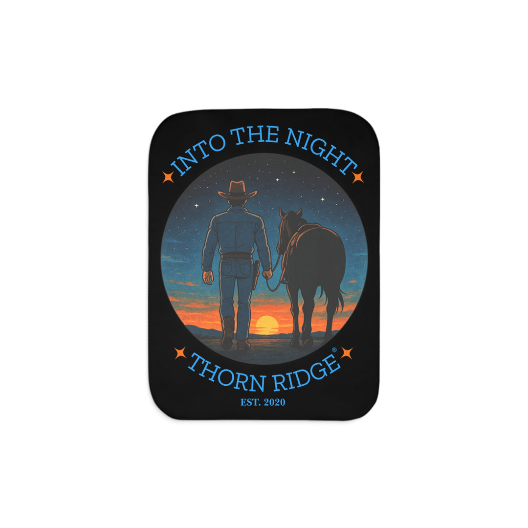 Into the Night by Thorn Ridge® EST 2020 black sherpa blanket with a circle image of a cowboy leading his horse into the sunset with the night sky with stars above them.