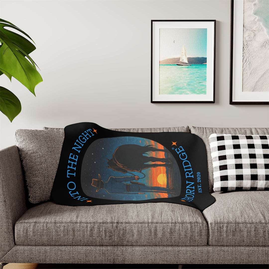 Into the Night by Thorn Ridge® EST 2020 black sherpa blanket with a circle image of a cowboy leading his horse into the sunset with the night sky with stars above them.