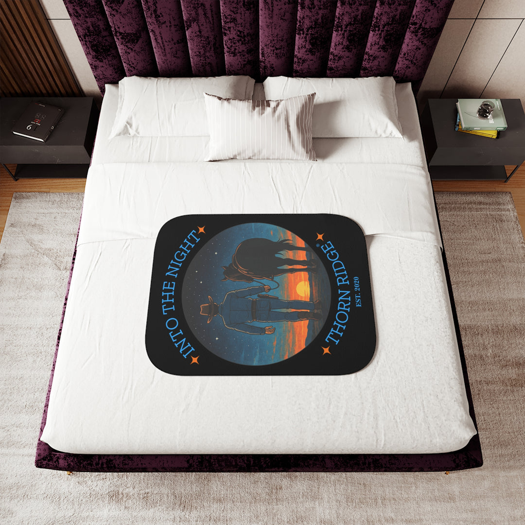 Into the Night by Thorn Ridge® EST 2020 black sherpa blanket with a circle image of a cowboy leading his horse into the sunset with the night sky with stars above them.