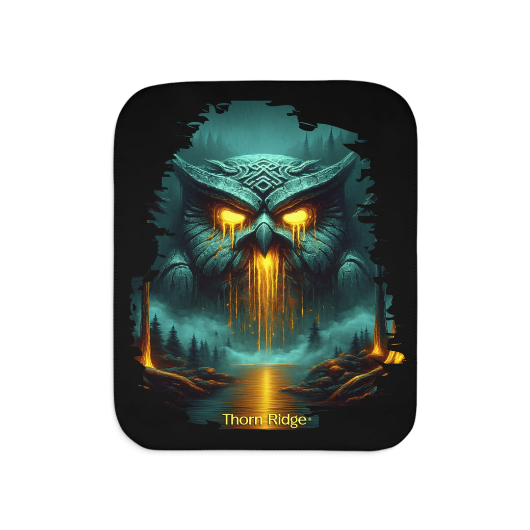 The Owl King from Thorn Ridge® Legends and Lore on a black sherpa blanket featuring a large stone owl in green tones with yellow lava running out of its eyes and mouth at the end of a river deep in the forest.