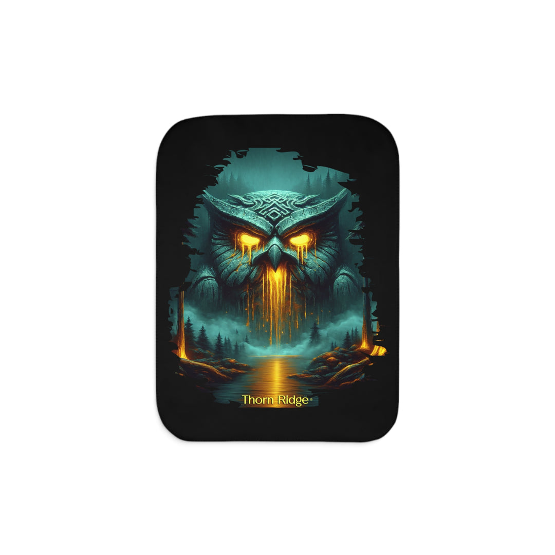 The Owl King from Thorn Ridge® Legends and Lore on a black sherpa blanket featuring a large stone owl in green tones with yellow lava running out of its eyes and mouth at the end of a river deep in the forest.