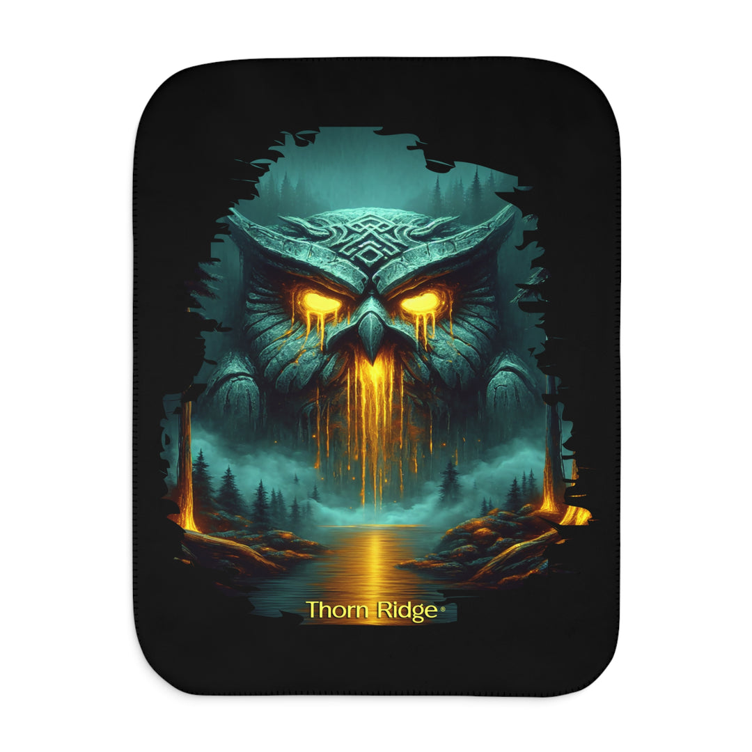 The Owl King from Thorn Ridge® Legends and Lore on a black sherpa blanket featuring a large stone owl in green tones with yellow lava running out of its eyes and mouth at the end of a river deep in the forest.