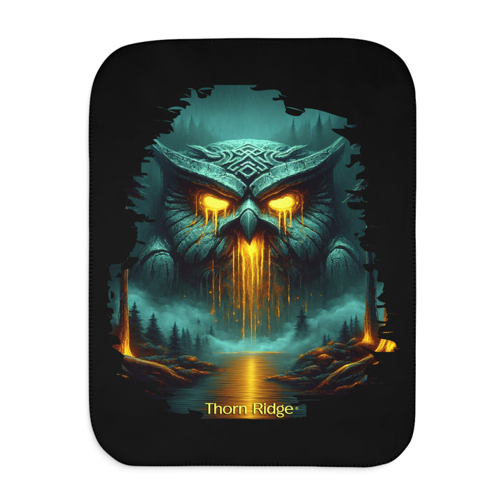 The Owl King from Thorn Ridge® Legends and Lore on a black sherpa blanket featuring a large stone owl in green tones with yellow lava running out of its eyes and mouth at the end of a river deep in the forest.