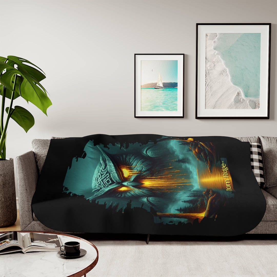 The Owl King from Thorn Ridge® Legends and Lore on a black sherpa blanket featuring a large stone owl in green tones with yellow lava running out of its eyes and mouth at the end of a river deep in the forest.