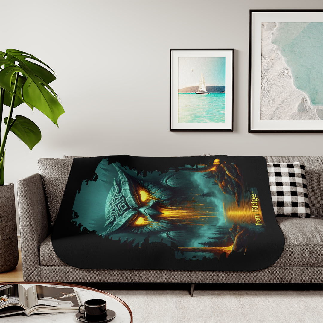 The Owl King from Thorn Ridge® Legends and Lore on a black sherpa blanket featuring a large stone owl in green tones with yellow lava running out of its eyes and mouth at the end of a river deep in the forest.