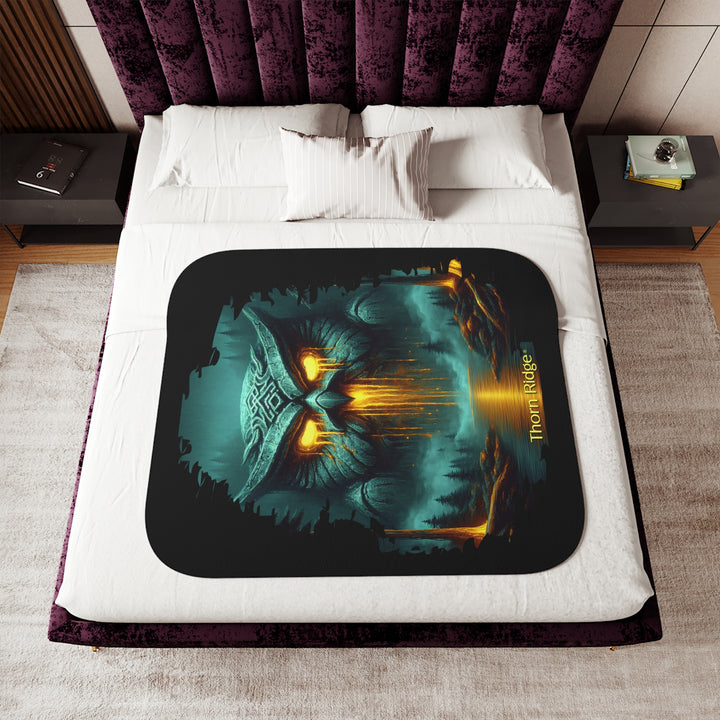 The Owl King from Thorn Ridge® Legends and Lore on a black sherpa blanket featuring a large stone owl in green tones with yellow lava running out of its eyes and mouth at the end of a river deep in the forest.