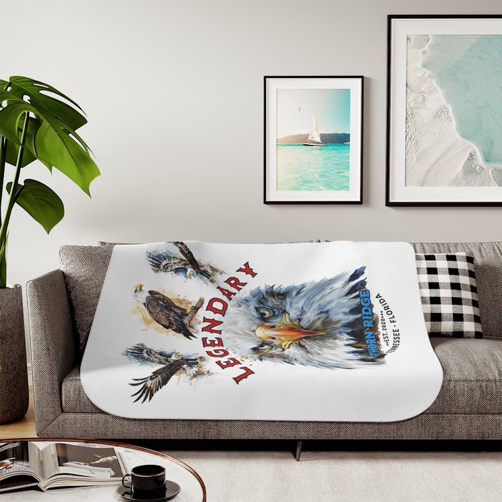 white sherpa blanket with the text Legendary and three bald eagles above the text and a close up of a bald eagle's face below the text. Branded as Thorn Ridge® EST 2020 Tennessee - Florida