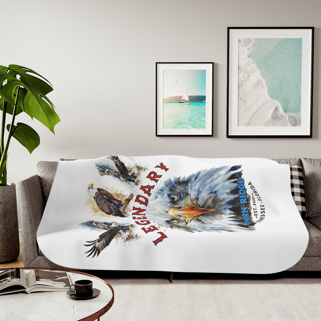 white sherpa blanket with the text Legendary and three bald eagles above the text and a close up of a bald eagle's face below the text. Branded as Thorn Ridge® EST 2020 Tennessee - Florida